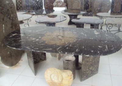 Black marble table with fossils
