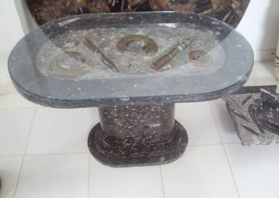 Marble and glass table with fossils