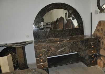 Black marble furniture with fossils